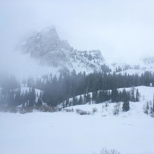 Lake Blanche and Sundial Peak in Utah in the snow and fog 