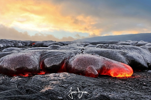Lava flowing from Kilauea volcano Hawaii  by James Binder