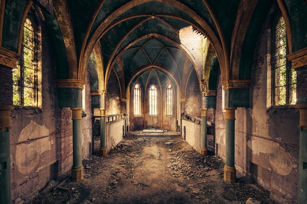 Light streams into an abandoned church  By Leon Beu