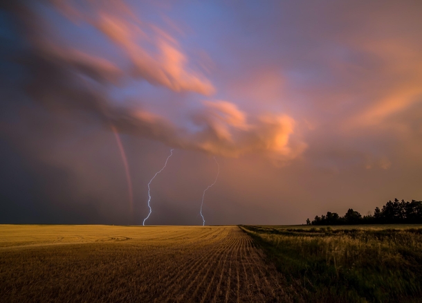 Lightning strikes and rainbow North Dakota