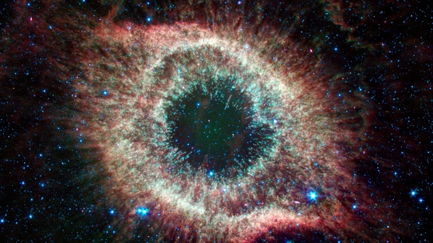 Located about  light-years from Earth the eye-like Helix nebula is a planetary nebula or the remains of a Sun-like star Credit NASAJPL-Caltech