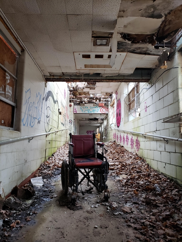Lonely wheelchair in abandoned state hospital