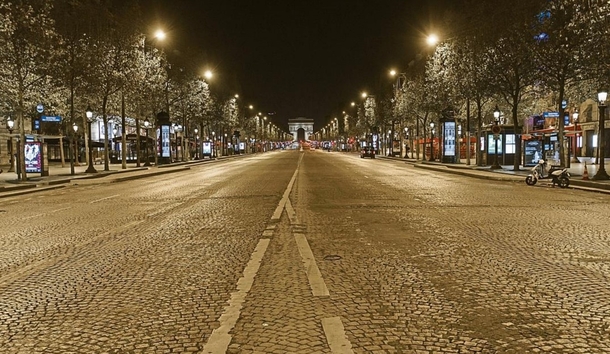 Looking along a deserted Champs Elysees to the Arc De Triomphe Paris Image - Dominique Boutin
