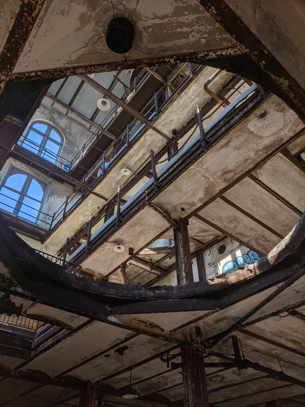 Looking up through a hole at an abandoned brewery