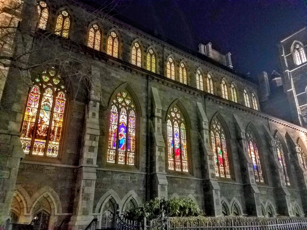 Magnificent s Mayer Munich Style painted glass in a jewel like pre-raphaelite palette illuminated and sparking at night at the Cathedral of the Holy Cross in Boston Massachusetts Recently it has been all restored cleaned  and releaded