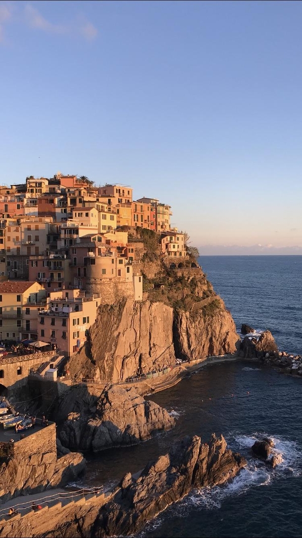 Manarola one of the five Cinque Terre cities in southern Italy basking in a sunset