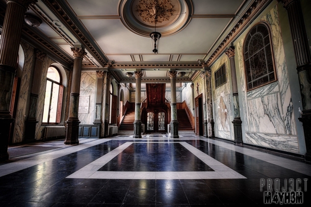 Marble clad entrance hall of an abandoned chateau in Belgium by Projct Myhm 