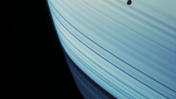 Mimas floats above the skies of Saturn Cassini 