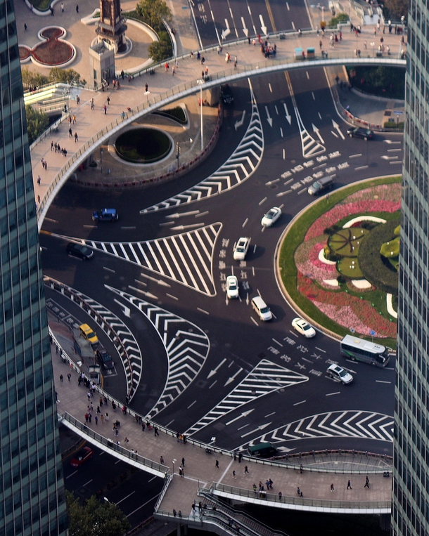 Mingzhu roundabout in Shanghai China with neat lane markings and an elevated pedestrian walkway
