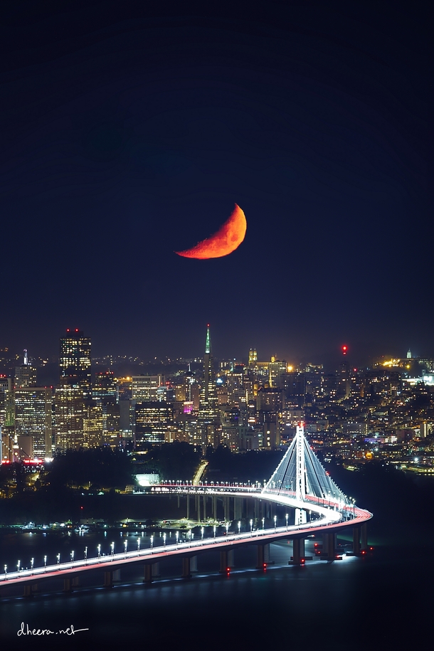 Moon setting over San Francisco with a long telephoto 