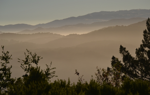 Morning Fog over layers of mountains in Carmel Valley CA Taken during a trail-building job of mine See more at seanaimages 