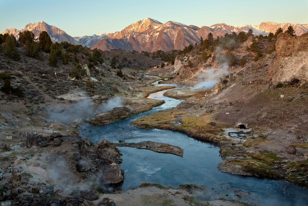 Morning steam rises from Hot Creek near Mammoth Lakes CA 