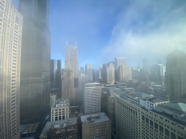 Morning sun burning off the fog in downtown Chicago