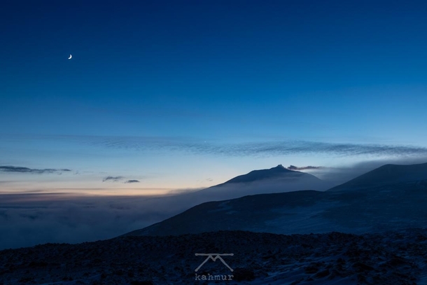 Mount Erebus under the Moon with mist over the sea ice Ross Island Antarctica 