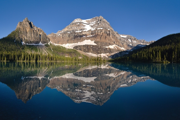 Mountain over a calm lake Alberta Canadax