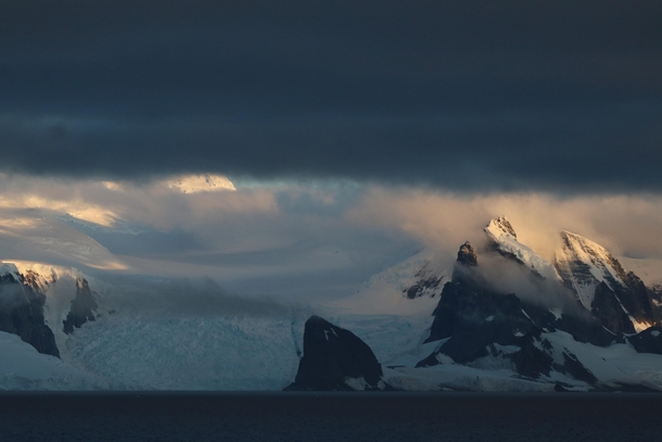 Mountains and a glacier at sunset Gerlache Channel Antarctica 