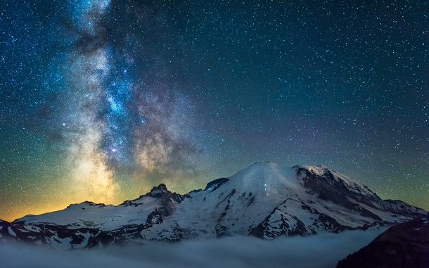 Mt Rainier with clouds below and the Milky Way by kdsphotography 