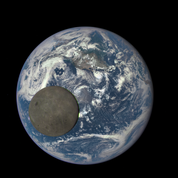 NASA camera shows dark side of the moon fully illuminated by the sun crossing the face of the Earth 