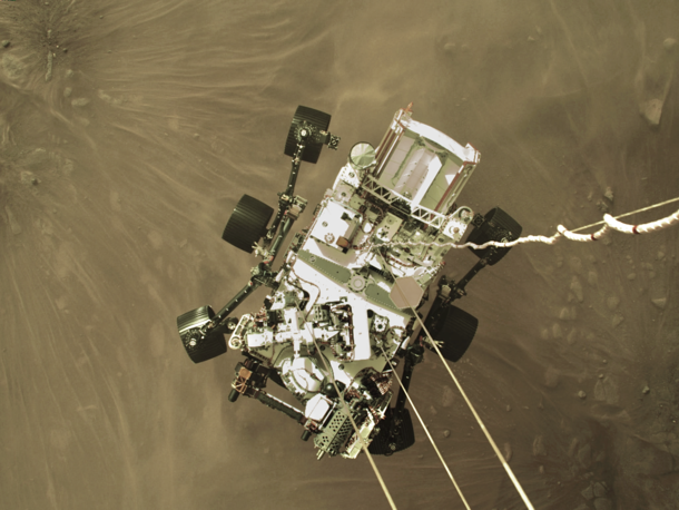 NASA releases first image of Perseverance Rover being lowered down onto the surface of Mars yesterday