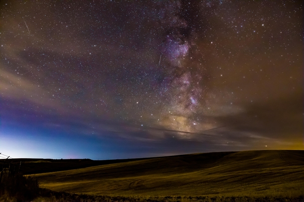 Near the WashingtonIdaho border sits the rolling fields of the Palouse The minor light pollution out here obscured the Milky Way with a little haze but was still very fun to shoot 