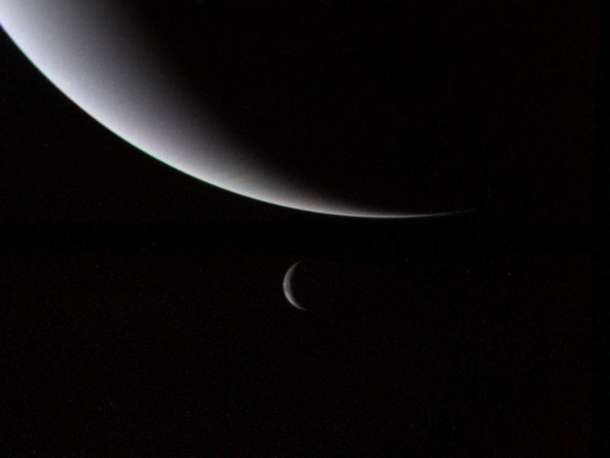 Neptune and one of its moons Triton Taken by the Voyager  spacecraft 