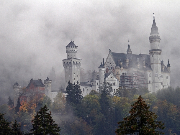 Neuschwanstein castle through mist Germany 