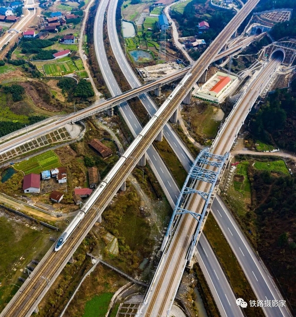 Newly build tunnels roads and railroads criss-crossing old vilages in Huaihua China