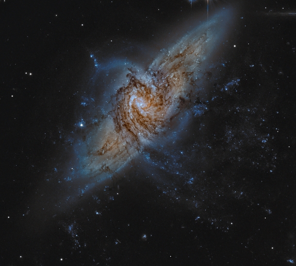 NGC   A unique pair of spiral galaxies that overlap separated by only  million light years 