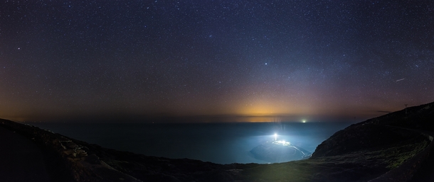 night sky over south stack lighthouse holyhead - wales 