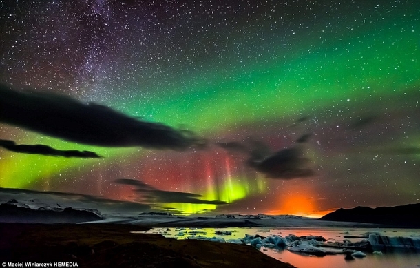 Northern Lights Milky Way and an ERUPTING VOLCANO in one photo Iceland by Maciej Winiarczyk 