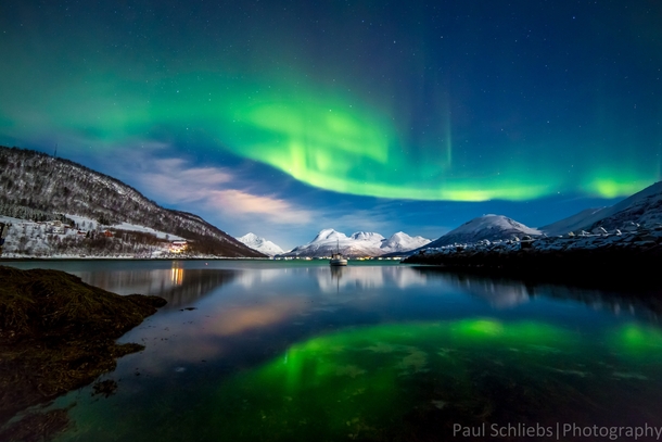 Northern Lights over the Fjords near Tromso Norway 