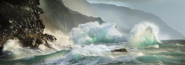 Ocean waves crashing into Napali Coast Kauai Hawaii 