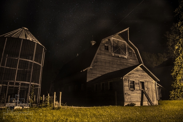 Old abandoned farm on a starry night in Iowa 