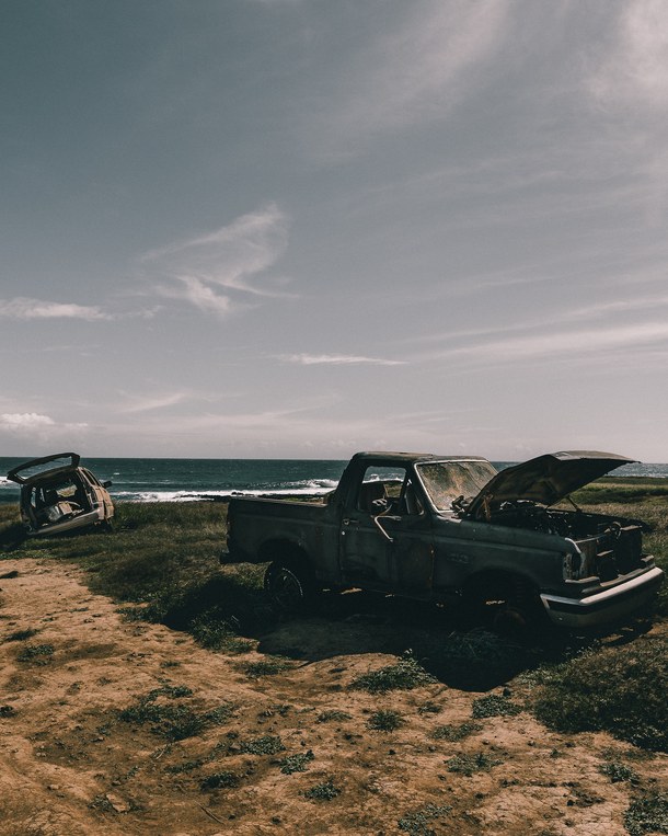 Old cars left on desolate beach in Hawaii