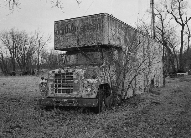Old North American truck sits decaying in a field in Iowa shot with Fuji GSs Kodak Tmax 
