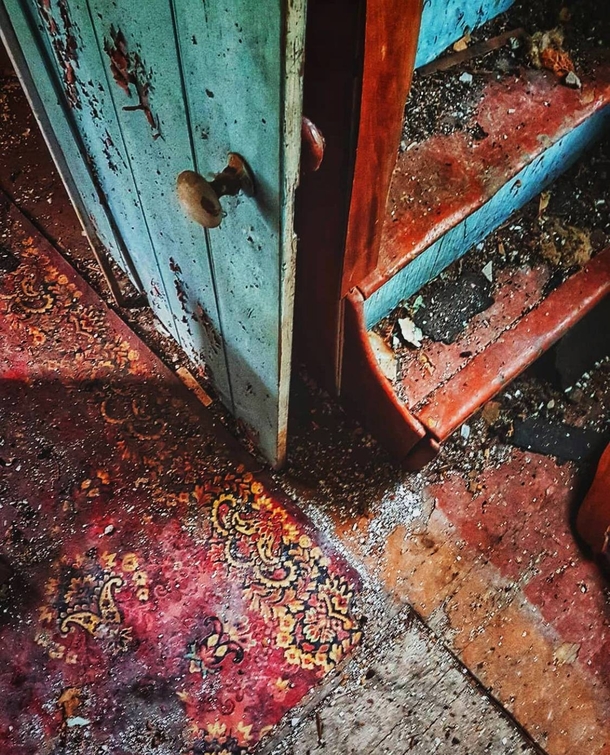 Old rural Ontario farmhouse with a lot of bright colours underneath the grime and decay