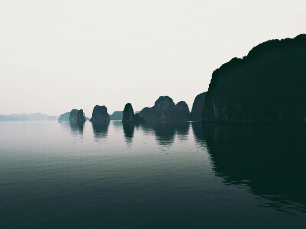 On a junk boat I woke up in this magical and eerie ancient place - Bai Tu Long Bay Vietnam 