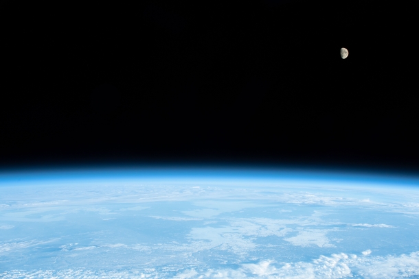Outer space Planet Earths Moon and Planet Earth photographed by Canadian Space Agency Astronaut David Saint-Jacques from the International Space Station on  December  Photo credit National Aeronautics and Space Administration NASA  Canadian Space Agency C