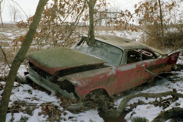 Potato quality but I thought you guys might like this poor abandoned Plymouth I found in the woods years ago 