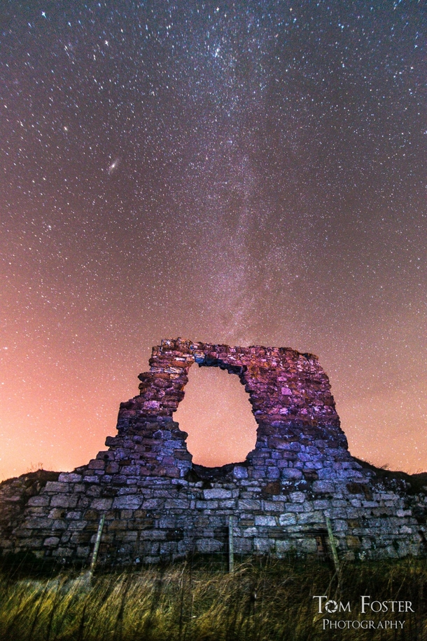 Remains of old Newark Castle St Monans Scotland and a number of galaxies 
