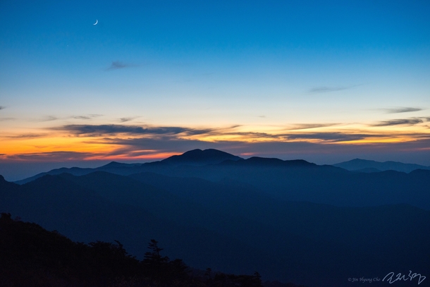 Right after the sunset from the top of Jirisan in South Korea I took this picture preparing dinner at the shelter on the ridge of the mountain 