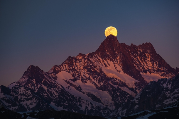 Rise of the super moon behind the Schreckhorn - the northernmost four-thousand-metre peak in Europe 