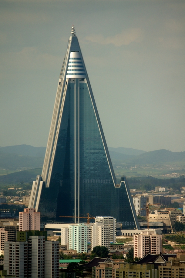 Ryugyong Hotel Hotel of Doom is -story pyramid-shaped skyscraper The construction began in  And has been halted over and over throughout the years The project has cost the N Koreans at least  of their GDP Pyongyang DPRK North Korea 
