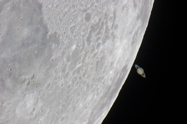 Saturn distance  billion km emerging from behind the Moon distance k km