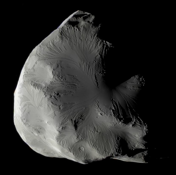 Saturns moon Helene a trojan moon of Dione co-orbital in L- point as seen by Cassini in approximate natural color Data taken in June 
