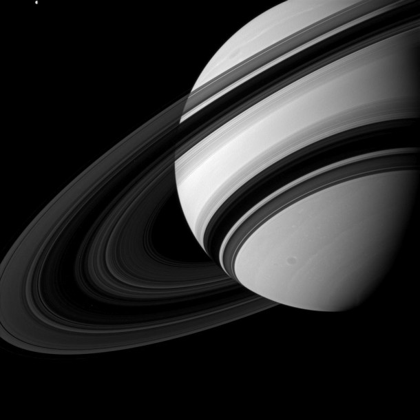 Saturns Rings from the Dark Side  At the top left of the frame is Saturns moon Tethys 