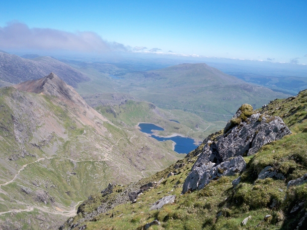 Seeing the mighty Yr Wyddfa on the front page inspired me to share one of my own Here is a shot taken from near the peak of Mt Snowdon on a beautiful June day 