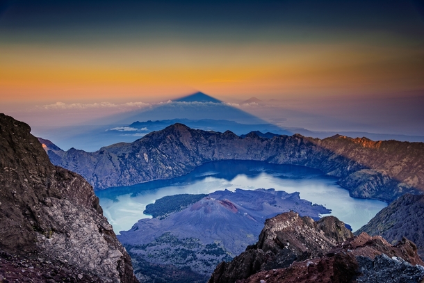 Shadow of mount Rinjani volcano at sunrise Indonesia writes photographer Julien Bo 