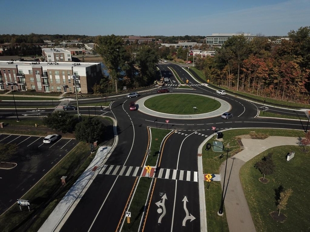 Since  Carmel Indiana a suburb of Indianapolis has replaced almost all of its signalized intersections with roundabouts They have  now and plan to reach 
