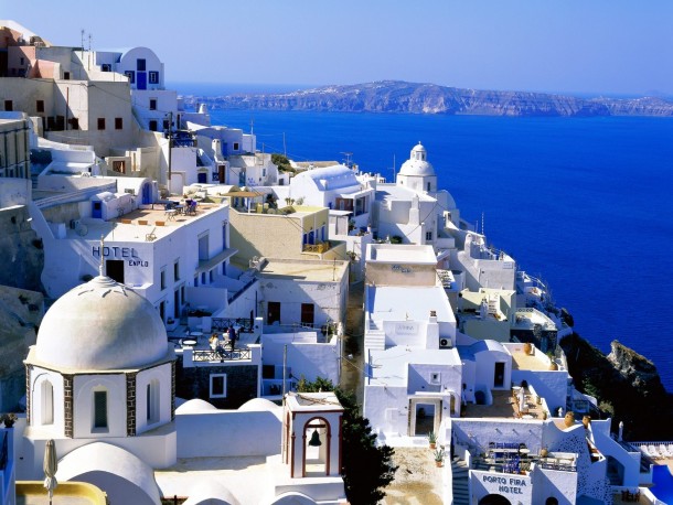 Sparkling village of Santorini against the azure sea and sky 